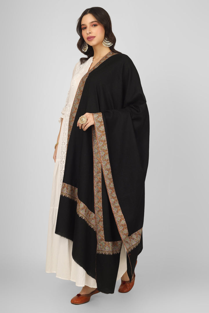 Authentic Kashmiri craftsmanship shines in the Black Maheen Pashmina Border Sozni Shawl. Made from natural pashmina wool, this luxurious piece features exquisite sozni embroidery along the borders, making it perfect for winter fashion or special occasions. Ideal as a wedding wrap or an elegant addition to your wardrobe, it’s one of the best pashmina shawls from Kashmir. Explore exclusive embroidered designs and buy pure pashmina shawls online today. Authentic Kashmiri craftsmanship shines in the Black Maheen Pashmina Border Sozni Shawl. Made from natural pashmina wool, this luxurious piece features exquisite sozni embroidery along the borders, making it perfect for winter fashion or special occasions. Ideal as a wedding wrap or an elegant addition to your wardrobe, it’s one of the best pashmina shawls from Kashmir. Explore exclusive embroidered designs and buy pure pashmina shawls online today.