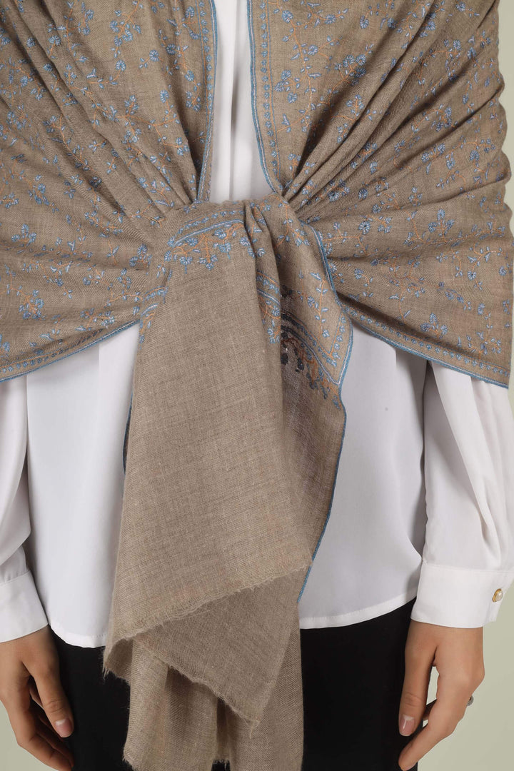 Hand-embroidered natural taupe pure Pashmina stole featuring an all-over sky-blue Sozni Jaldaar floral vine pattern from Kepra.
| pashmina shawls online | authentic Kashmiri pashmina shawl online | pure pashmina shawl online | original GI certified pashmina shawl online | luxury men's pashmina shawl online from Kashmir | where to buy online pure pashmina in India
| GI Tag Certified - Government-verified authentic Kashmiri Pashmina
| G20 Official Partner - Selected by India for G20 Summit gifting
| Handicraft Registered - Official recognition of traditional craftsmanship
| Certificate of Authenticity - Every purchase includes GI certification Hand-embroidered natural taupe pure Pashmina stole featuring an all-over sky-blue Sozni Jaldaar floral vine pattern from Kepra.
| pashmina shawls online | authentic Kashmiri pashmina shawl online | pure pashmina shawl online | original GI certified pashmina shawl online | luxury men's pashmina shawl online from Kashmir | where to buy online pure pashmina in India
| GI Tag Certified - Government-verified authentic Kashmiri Pashmina
| G20 Official Partner - Selected by India for G20 Summit gifting
| Handicraft Registered - Official recognition of traditional craftsmanship
| Certificate of Authenticity - Every purchase includes GI certification