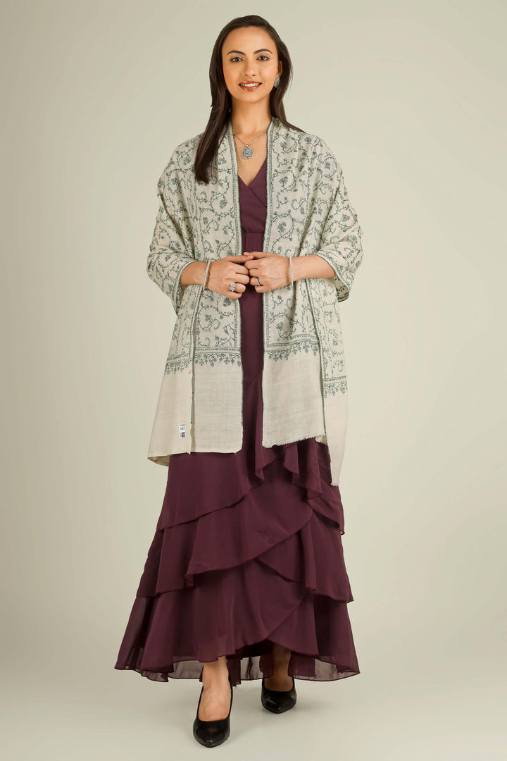 Ivory Kashmiri pure pashmina embroidered stole with green vine motifs by Kepra, wrapped around neck over plum dress, front detail view for Barcelona winter styling
| pashmina shawls online | authentic Kashmiri pashmina shawl online | pure pashmina shawl online | original GI certified pashmina shawl online | luxury men's pashmina shawl online from Kashmir | where to buy online pure pashmina in India
| GI Tag Certified - Government-verified authentic Kashmiri Pashmina
| G20 Official Partner - Selected by India for G20 Summit gifting
| Handicraft Registered - Official recognition of traditional craftsmanship
| Certificate of Authenticity - Every purchase includes GI certification Ivory Kashmiri pure pashmina embroidered stole with green vine motifs by Kepra, wrapped around neck over plum dress, front detail view for Barcelona winter styling
| pashmina shawls online | authentic Kashmiri pashmina shawl online | pure pashmina shawl online | original GI certified pashmina shawl online | luxury men's pashmina shawl online from Kashmir | where to buy online pure pashmina in India
| GI Tag Certified - Government-verified authentic Kashmiri Pashmina
| G20 Official Partner - Selected by India for G20 Summit gifting
| Handicraft Registered - Official recognition of traditional craftsmanship
| Certificate of Authenticity - Every purchase includes GI certification