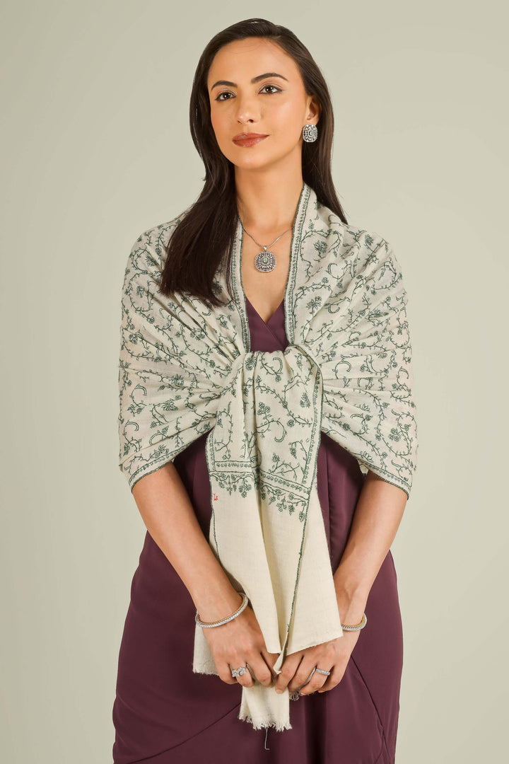 Ivory Kashmiri pure pashmina embroidered stole with green vine motifs by Kepra, wrapped around neck over plum dress, front detail view for Barcelona winter styling
| pashmina shawls online | authentic Kashmiri pashmina shawl online | pure pashmina shawl online | original GI certified pashmina shawl online | luxury men's pashmina shawl online from Kashmir | where to buy online pure pashmina in India
| GI Tag Certified - Government-verified authentic Kashmiri Pashmina
| G20 Official Partner - Selected by India for G20 Summit gifting
| Handicraft Registered - Official recognition of traditional craftsmanship
| Certificate of Authenticity - Every purchase includes GI certification Ivory Kashmiri pure pashmina embroidered stole with green vine motifs by Kepra, wrapped around neck over plum dress, front detail view for Barcelona winter styling
| pashmina shawls online | authentic Kashmiri pashmina shawl online | pure pashmina shawl online | original GI certified pashmina shawl online | luxury men's pashmina shawl online from Kashmir | where to buy online pure pashmina in India
| GI Tag Certified - Government-verified authentic Kashmiri Pashmina
| G20 Official Partner - Selected by India for G20 Summit gifting
| Handicraft Registered - Official recognition of traditional craftsmanship
| Certificate of Authenticity - Every purchase includes GI certification