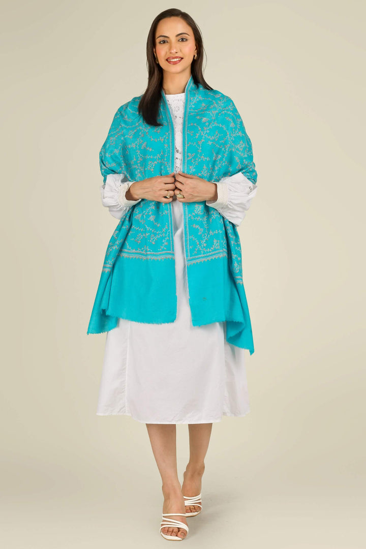 This GI Turquoise Kashmiri Pure Pashmina Embroidered Stole is a bright, refreshing accessory, handwoven in Kashmir and patterned with delicate all-over vines that frame the edges and flow softly along the length of the fabric.
| pashmina shawls online | authentic Kashmiri pashmina shawl online | pure pashmina shawl online | original GI certified pashmina shawl online | luxury men's pashmina shawl online from Kashmir | where to buy online pure pashmina in India
| GI Tag Certified - Government-verified authentic Kashmiri Pashmina
| G20 Official Partner - Selected by India for G20 Summit gifting
| Handicraft Registered - Official recognition of traditional craftsmanship
| Certificate of Authenticity - Every purchase includes GI certification This GI Turquoise Kashmiri Pure Pashmina Embroidered Stole is a bright, refreshing accessory, handwoven in Kashmir and patterned with delicate all-over vines that frame the edges and flow softly along the length of the fabric.
| pashmina shawls online | authentic Kashmiri pashmina shawl online | pure pashmina shawl online | original GI certified pashmina shawl online | luxury men's pashmina shawl online from Kashmir | where to buy online pure pashmina in India
| GI Tag Certified - Government-verified authentic Kashmiri Pashmina
| G20 Official Partner - Selected by India for G20 Summit gifting
| Handicraft Registered - Official recognition of traditional craftsmanship
| Certificate of Authenticity - Every purchase includes GI certification
