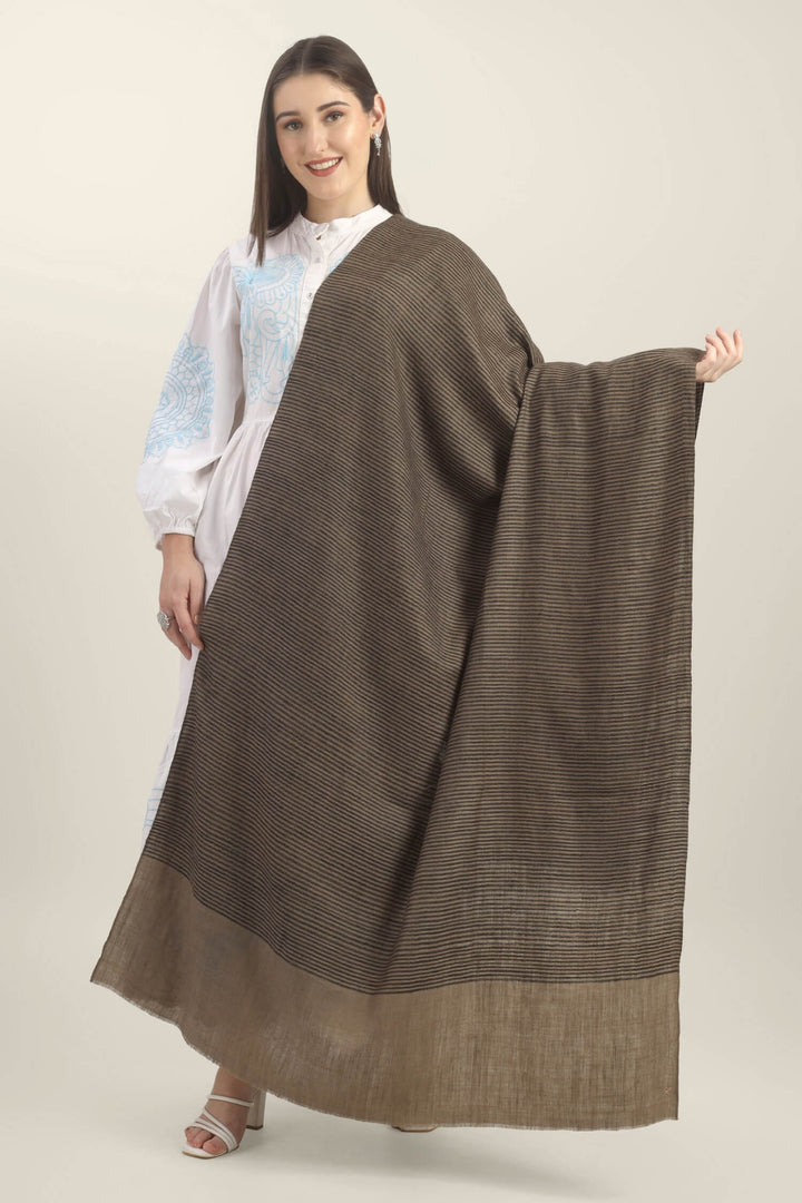 Model holding a taupe Pure Kashmiri Pashmina shawl with fine black woven stripes and a wide plain border over a white embroidered dress.
| pashmina shawls online | authentic Kashmiri pashmina shawl online | pure pashmina shawl online | original GI certified pashmina shawl online | luxury men's pashmina shawl online from Kashmir | where to buy online pure pashmina in India
| GI Tag Certified - Government-verified authentic Kashmiri Pashmina
| G20 Official Partner - Selected by India for G20 Summit gifting
| Handicraft Registered - Official recognition of traditional craftsmanship
| Certificate of Authenticity - Every purchase includes GI certification Model holding a taupe Pure Kashmiri Pashmina shawl with fine black woven stripes and a wide plain border over a white embroidered dress.
| pashmina shawls online | authentic Kashmiri pashmina shawl online | pure pashmina shawl online | original GI certified pashmina shawl online | luxury men's pashmina shawl online from Kashmir | where to buy online pure pashmina in India
| GI Tag Certified - Government-verified authentic Kashmiri Pashmina
| G20 Official Partner - Selected by India for G20 Summit gifting
| Handicraft Registered - Official recognition of traditional craftsmanship
| Certificate of Authenticity - Every purchase includes GI certification