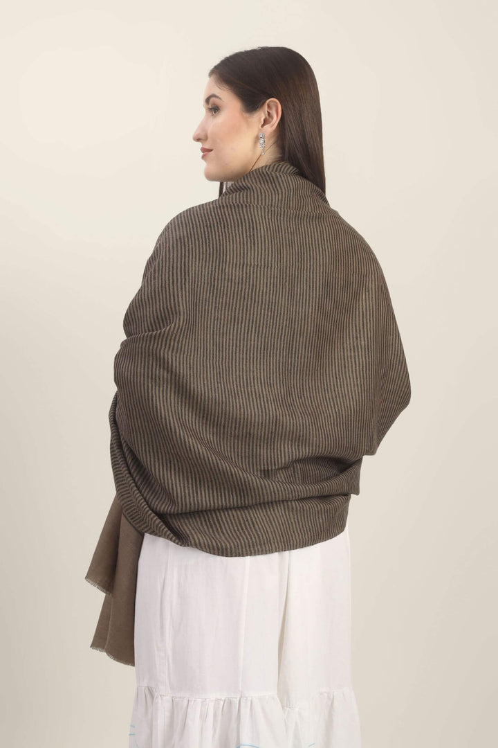 Model holding a taupe Pure Kashmiri Pashmina shawl with fine black woven stripes and a wide plain border over a white embroidered dress.
| pashmina shawls online | authentic Kashmiri pashmina shawl online | pure pashmina shawl online | original GI certified pashmina shawl online | luxury men's pashmina shawl online from Kashmir | where to buy online pure pashmina in India
| GI Tag Certified - Government-verified authentic Kashmiri Pashmina
| G20 Official Partner - Selected by India for G20 Summit gifting
| Handicraft Registered - Official recognition of traditional craftsmanship
| Certificate of Authenticity - Every purchase includes GI certification Model holding a taupe Pure Kashmiri Pashmina shawl with fine black woven stripes and a wide plain border over a white embroidered dress.
| pashmina shawls online | authentic Kashmiri pashmina shawl online | pure pashmina shawl online | original GI certified pashmina shawl online | luxury men's pashmina shawl online from Kashmir | where to buy online pure pashmina in India
| GI Tag Certified - Government-verified authentic Kashmiri Pashmina
| G20 Official Partner - Selected by India for G20 Summit gifting
| Handicraft Registered - Official recognition of traditional craftsmanship
| Certificate of Authenticity - Every purchase includes GI certification