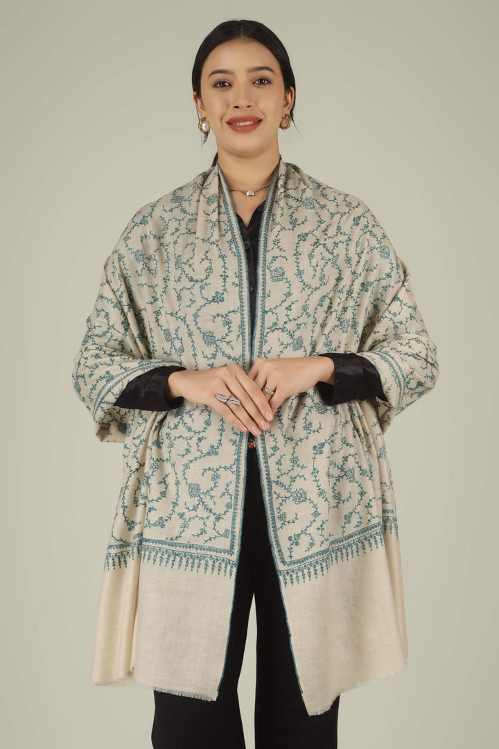 Hand-embroidered ivory off-white pure Pashmina stole featuring an all-over teal Sozni Jaldaar floral vine pattern from Kepra.
| pashmina shawls online | authentic Kashmiri pashmina shawl online | pure pashmina shawl online | original GI certified pashmina shawl online | luxury men's pashmina shawl online from Kashmir | where to buy online pure pashmina in India
| GI Tag Certified - Government-verified authentic Kashmiri Pashmina
| G20 Official Partner - Selected by India for G20 Summit gifting
| Handicraft Registered - Official recognition of traditional craftsmanship
| Certificate of Authenticity - Every purchase includes GI certification Hand-embroidered ivory off-white pure Pashmina stole featuring an all-over teal Sozni Jaldaar floral vine pattern from Kepra.
| pashmina shawls online | authentic Kashmiri pashmina shawl online | pure pashmina shawl online | original GI certified pashmina shawl online | luxury men's pashmina shawl online from Kashmir | where to buy online pure pashmina in India
| GI Tag Certified - Government-verified authentic Kashmiri Pashmina
| G20 Official Partner - Selected by India for G20 Summit gifting
| Handicraft Registered - Official recognition of traditional craftsmanship
| Certificate of Authenticity - Every purchase includes GI certification
