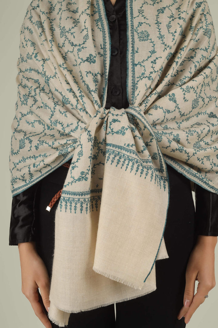 Hand-embroidered ivory off-white pure Pashmina stole featuring an all-over teal Sozni Jaldaar floral vine pattern from Kepra.
| pashmina shawls online | authentic Kashmiri pashmina shawl online | pure pashmina shawl online | original GI certified pashmina shawl online | luxury men's pashmina shawl online from Kashmir | where to buy online pure pashmina in India
| GI Tag Certified - Government-verified authentic Kashmiri Pashmina
| G20 Official Partner - Selected by India for G20 Summit gifting
| Handicraft Registered - Official recognition of traditional craftsmanship
| Certificate of Authenticity - Every purchase includes GI certification Hand-embroidered ivory off-white pure Pashmina stole featuring an all-over teal Sozni Jaldaar floral vine pattern from Kepra.
| pashmina shawls online | authentic Kashmiri pashmina shawl online | pure pashmina shawl online | original GI certified pashmina shawl online | luxury men's pashmina shawl online from Kashmir | where to buy online pure pashmina in India
| GI Tag Certified - Government-verified authentic Kashmiri Pashmina
| G20 Official Partner - Selected by India for G20 Summit gifting
| Handicraft Registered - Official recognition of traditional craftsmanship
| Certificate of Authenticity - Every purchase includes GI certification