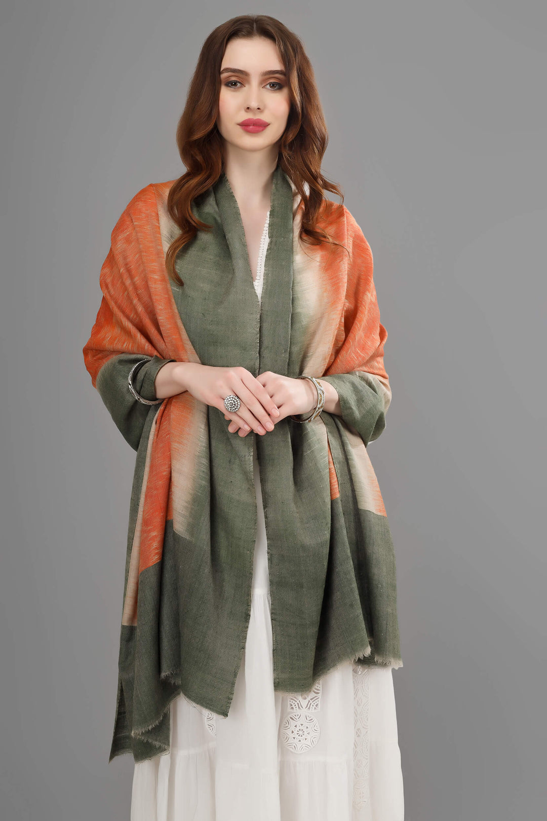 This luxurious, authentic and handmade Pashmina Stole, designed in a Dubai Ikkat pattern, is crafted by the most talented and skilled Artisans.