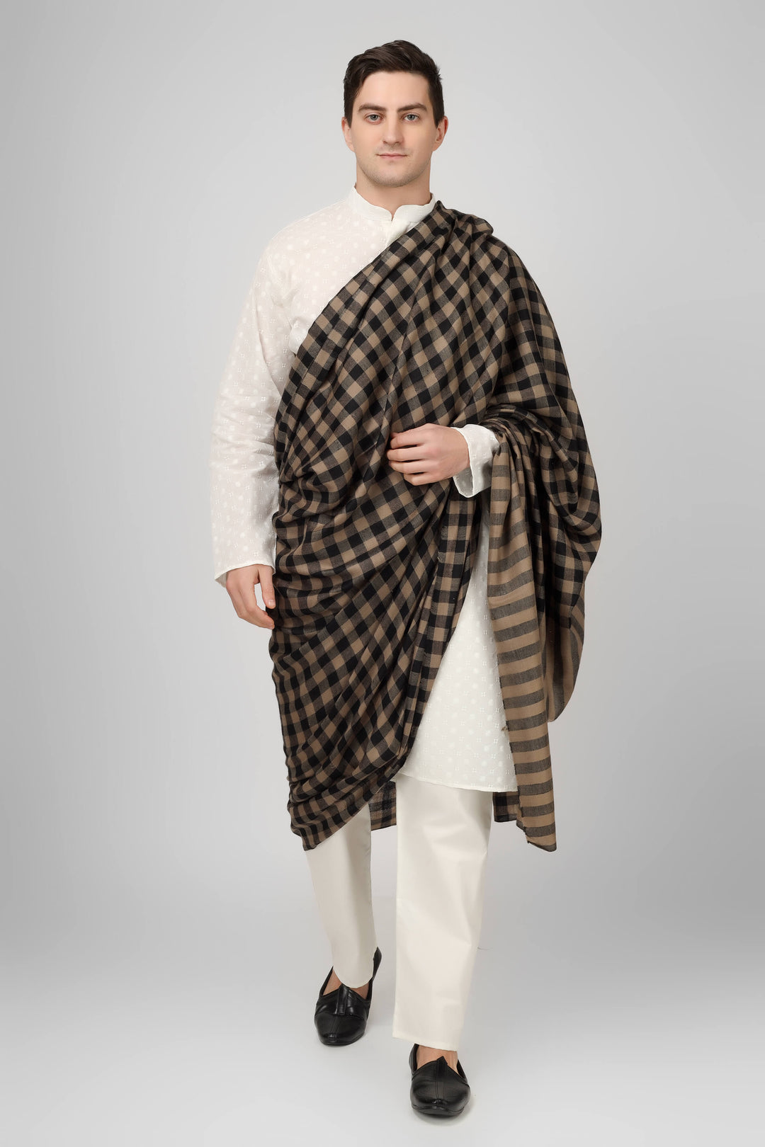 the shawl, each one meticulously stitched to perfection, showcase the artisan's skill. In Delhi, these pashmina shawls are typically worn with kurta pyjamas to create an attractive appearance.