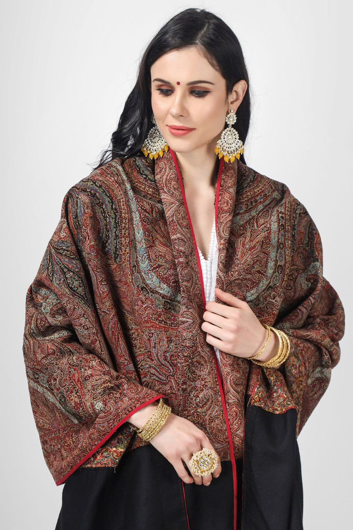 Black pashmina shawl from the 19th century with a typical pattern—the boteh or paisley shape—enveloping a beautiful centre known as chand center medallion. The original neutral colors  maroon and black  are still present and have not faded with time. Shawls have been made in kashmir  and worn for years by elegant women since they have always been seen as luxury items.   Methods and Materials, Handwoven Pashmina Wool, India/Kashmir, Period: 19th Century, Year of Production: Around 1850"s Black pashmina shawl from the 19th century with a typical pattern—the boteh or paisley shape—enveloping a beautiful centre known as chand center medallion. The original neutral colors  maroon and black  are still present and have not faded with time. Shawls have been made in kashmir  and worn for years by elegant women since they have always been seen as luxury items.   Methods and Materials, Handwoven Pashmina Wool, India/Kashmir, Period: 19th Century, Year of Production: Around 1850"s