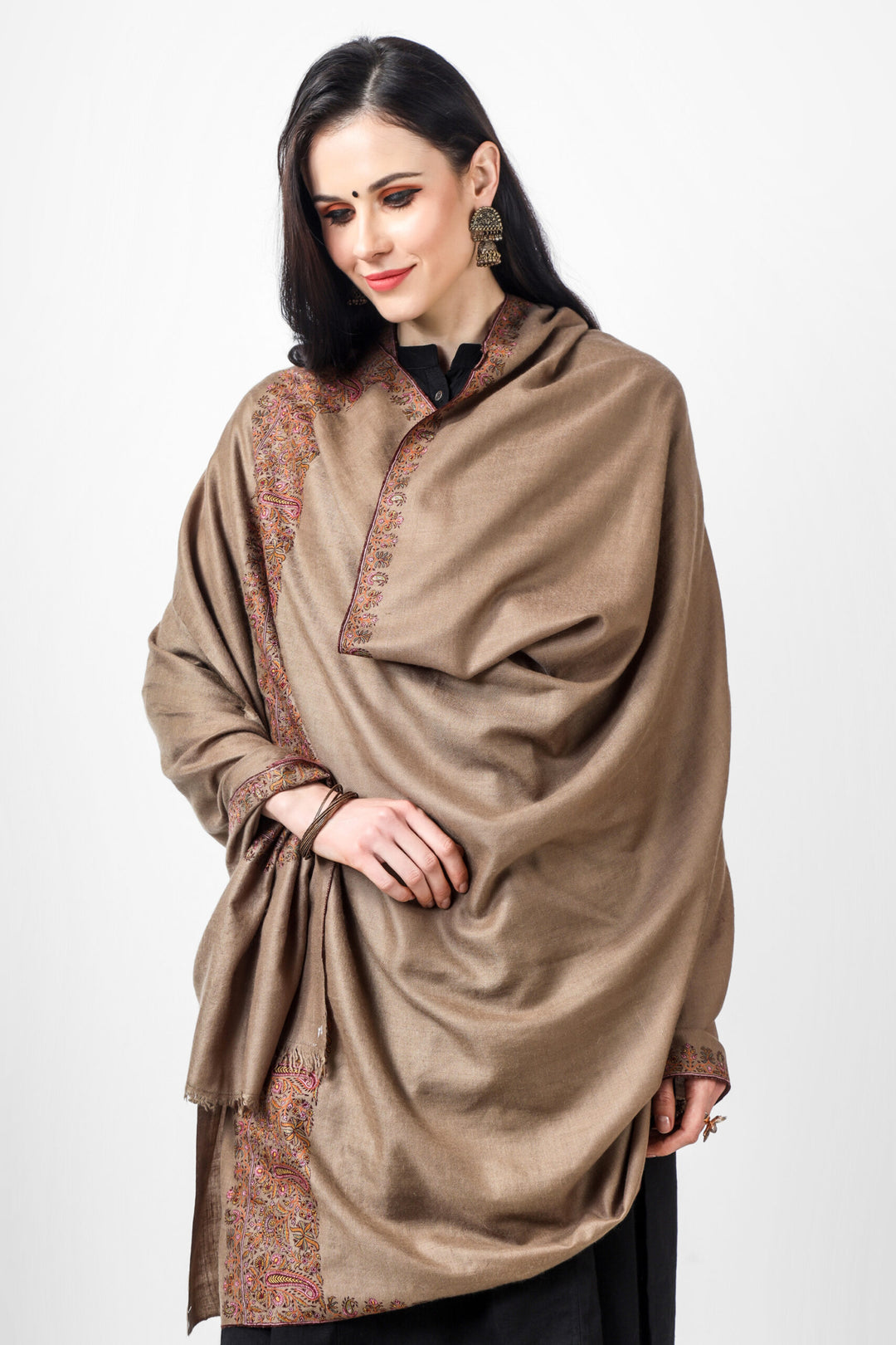 Surround yourself with richness with a handcrafted Kashmiri pashmina shawl. This designer pashmina shawl helps keep you warm and glamorous. It is created from the finest pashmina wool and features gorgeous embroidery, making it the ideal accessory for any event. Traditionally known as the Dordaar design.