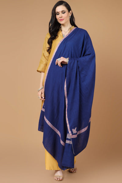This stunning blue Pashmina Shawl was meticulously handcrafted and passionately woven. It includes a stunning Sozni border, often known as the Hashidaar design.  Give yourself the royal treatment and luxury of a Pashmina and centuries-old Sozni needlework.