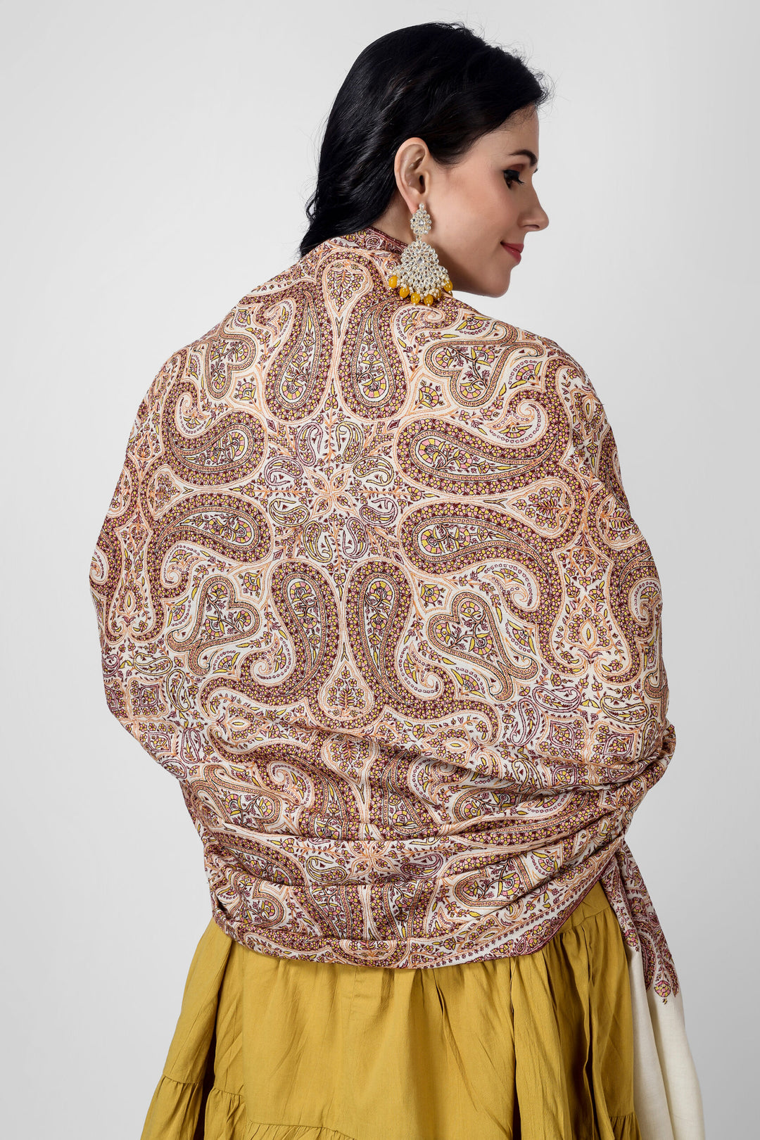This beautiful white pashmina shawl is a unique piece of art, featuring intricate embroidery with a timeless khatmband design. Perfect for formal or casual settings .
