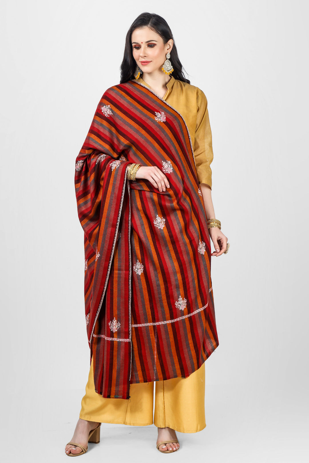 This Beautiful and ravishing Pashmina Shawl features a legendary Sozni Embroidery on a stripped red pashmina base in an intricate Bootidaar pattern, making this luxurious piece stand out. Charming Sozni threads span across the surface of fine Pashm threads in floral vines.