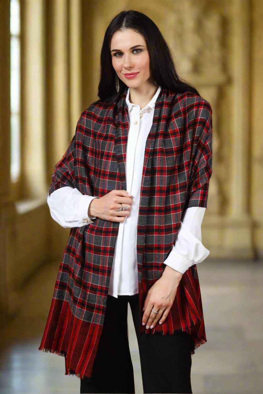 The Maroon Check Designer Pashmina Stole is a luxurious and versatile accessory made from high-quality pashmina wool. Its elegant check design adds sophistication to any outfit.