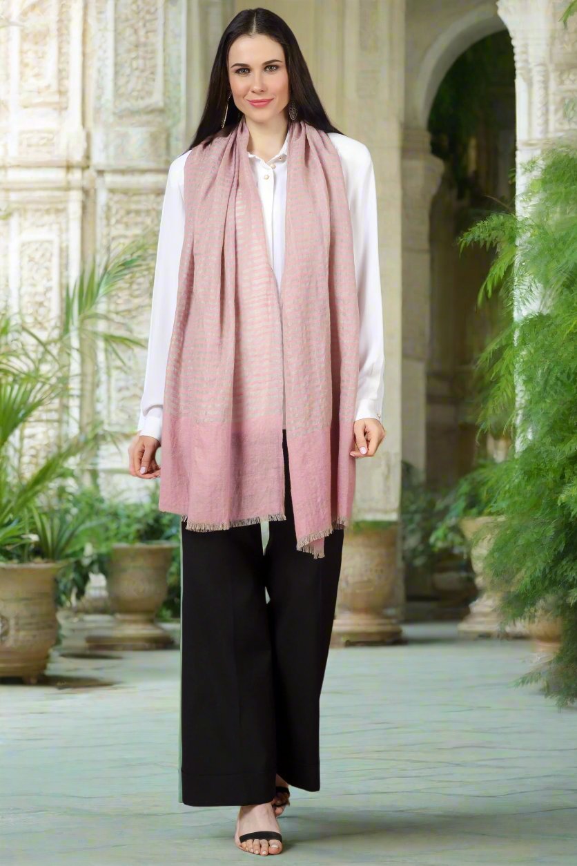 The stole is hand woven in a light pink with stripes design to complement your winter outfits in the most stylish manner. It has bright colours, a fine texture, and a comforting warm touch of the beloved blue Pashmina. enjoy the comfort of real pashmina stoles on your shoulder