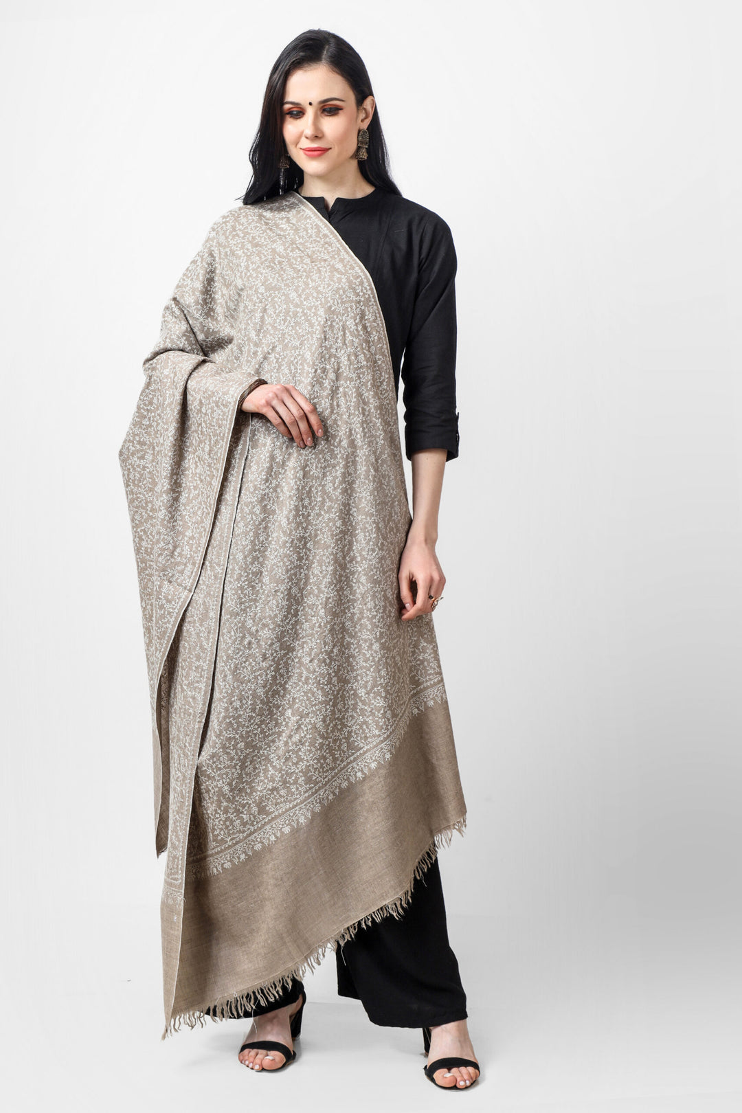The Natural Pashmina Jaldaar Graceful White Embroidered Shawl is a classic and elegant accessory that adds a touch of sophistication to any outfit. The combination of the natural white color and intricate embroidery creates a beautiful and graceful look that is perfect for any occasion.