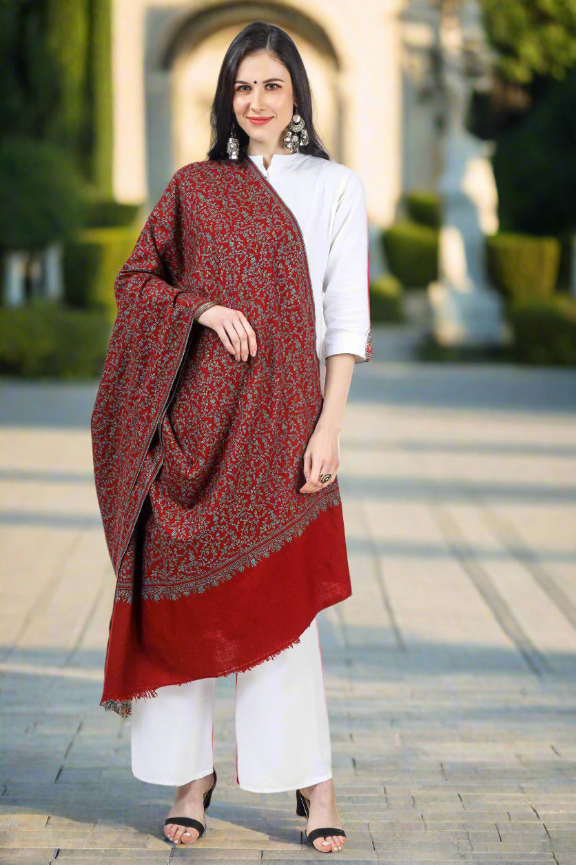 The Maroon Jaldaar Sozni Embroidered Pashmina Shawl is a stunning accessory made from high-quality pashmina wool.