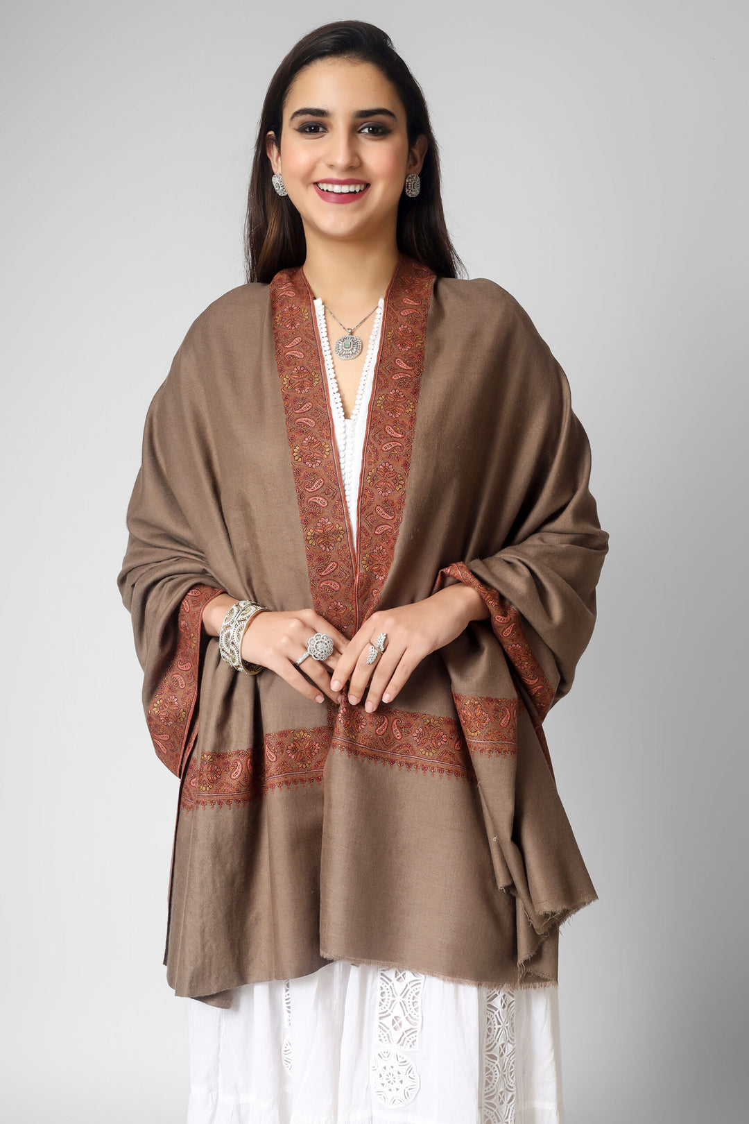 Treat  your loved ones to the timeless elegance of our authentic, hand-loomed toosh color border pashmina shawls. Made from natural pashmina our shawls feature intricate embroidery and exquisite designs that are perfect for any fashion-conscious individual looking to add a touch of sophistication to their wardrobe.