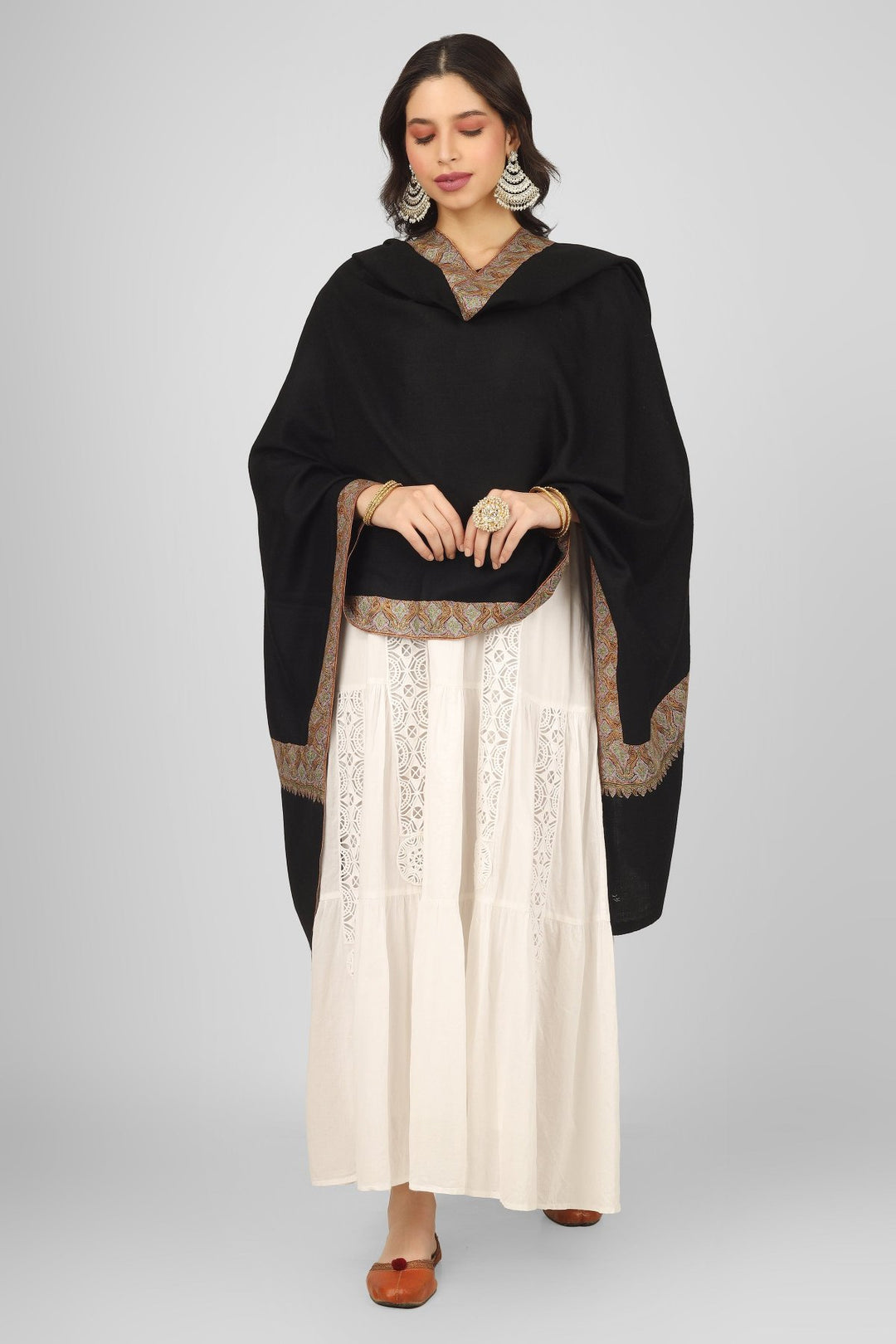 Authentic Kashmiri craftsmanship shines in the Black Maheen Pashmina Border Sozni Shawl. Made from natural pashmina wool, this luxurious piece features exquisite sozni embroidery along the borders, making it perfect for winter fashion or special occasions. Ideal as a wedding wrap or an elegant addition to your wardrobe, it’s one of the best pashmina shawls from Kashmir. Explore exclusive embroidered designs and buy pure pashmina shawls online today.