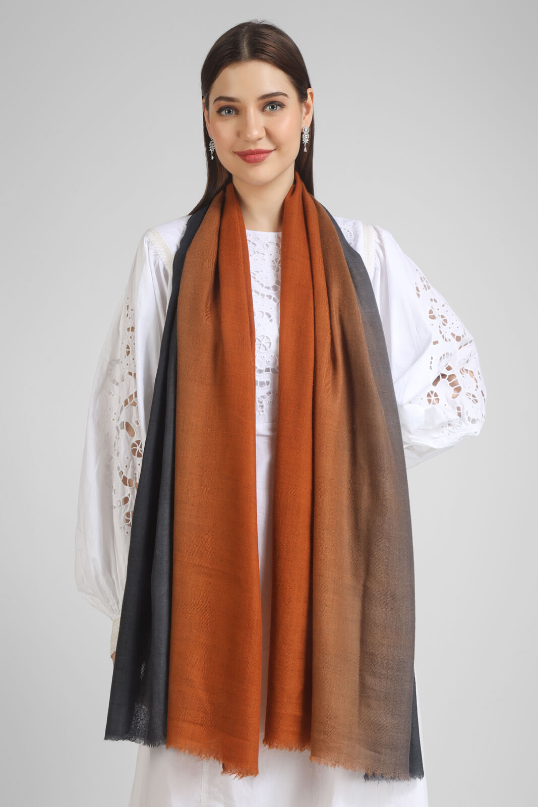 pashmina stoles Rust & Grey Ombre Pashmina Stole – a fusion of warm tones and cool grays.- We deliver our premium Pashmina products to the United Kingdom, Germany, France, Japan, UAE, and Australia. Elevate your style with ease – order now!"