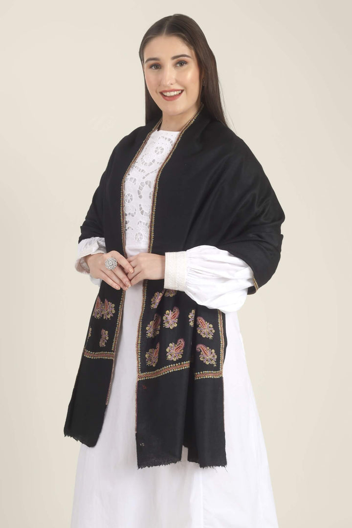 Model wearing a black GI Kashmiri Pure Pashmina stole with multicolour paisley Sozni embroidery on the borders over a white outfit.
    
      | pashmina shawls online | authentic Kashmiri pashmina shawl online | pure pashmina shawl online | original GI certified pashmina shawl online | luxury men's pashmina shawl online from Kashmir | where to buy online pure pashmina in India
    
    | GI Tag Certified - Government-verified authentic Kashmiri Pashmina
    | G20 Official Partner - Selected by India for G20 Summit gifting
    | Handicraft Registered - Official recognition of traditional craftsmanship
    | Certificate of Authenticity - Every purchase includes GI certification
