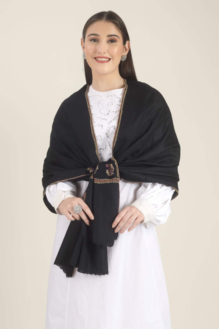 Model wearing a black GI Kashmiri Pure Pashmina stole with multicolour paisley Sozni embroidery on the borders over a white outfit.
    
      | pashmina shawls online | authentic Kashmiri pashmina shawl online | pure pashmina shawl online | original GI certified pashmina shawl online | luxury men's pashmina shawl online from Kashmir | where to buy online pure pashmina in India
    
    | GI Tag Certified - Government-verified authentic Kashmiri Pashmina
    | G20 Official Partner - Selected by India for G20 Summit gifting
    | Handicraft Registered - Official recognition of traditional craftsmanship
    | Certificate of Authenticity - Every purchase includes GI certification