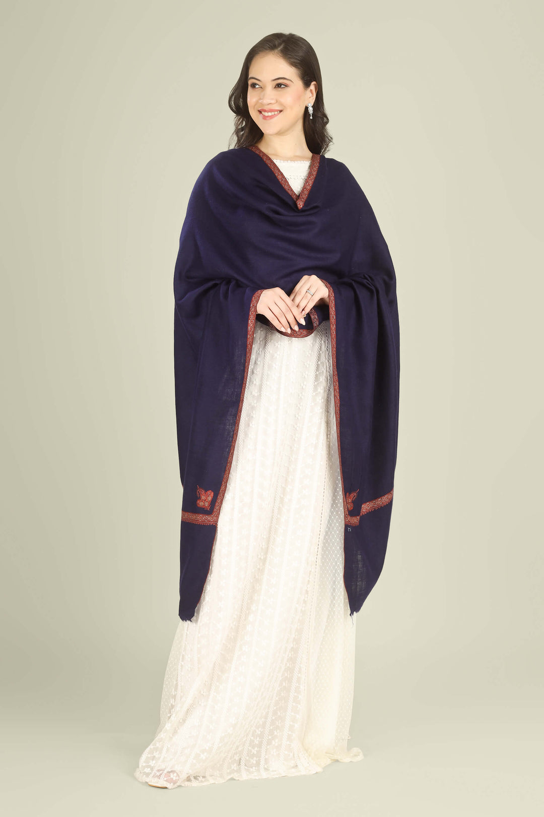 This Navy GI Kashmiri Pure Pashmina Nusrat Hashidaar Shawl showcases a deep navy base framed with a rich rust–orange Nusrat hashidaar border and a single paisley corner motif, giving a bold colour contrast with refined, minimal detailing.