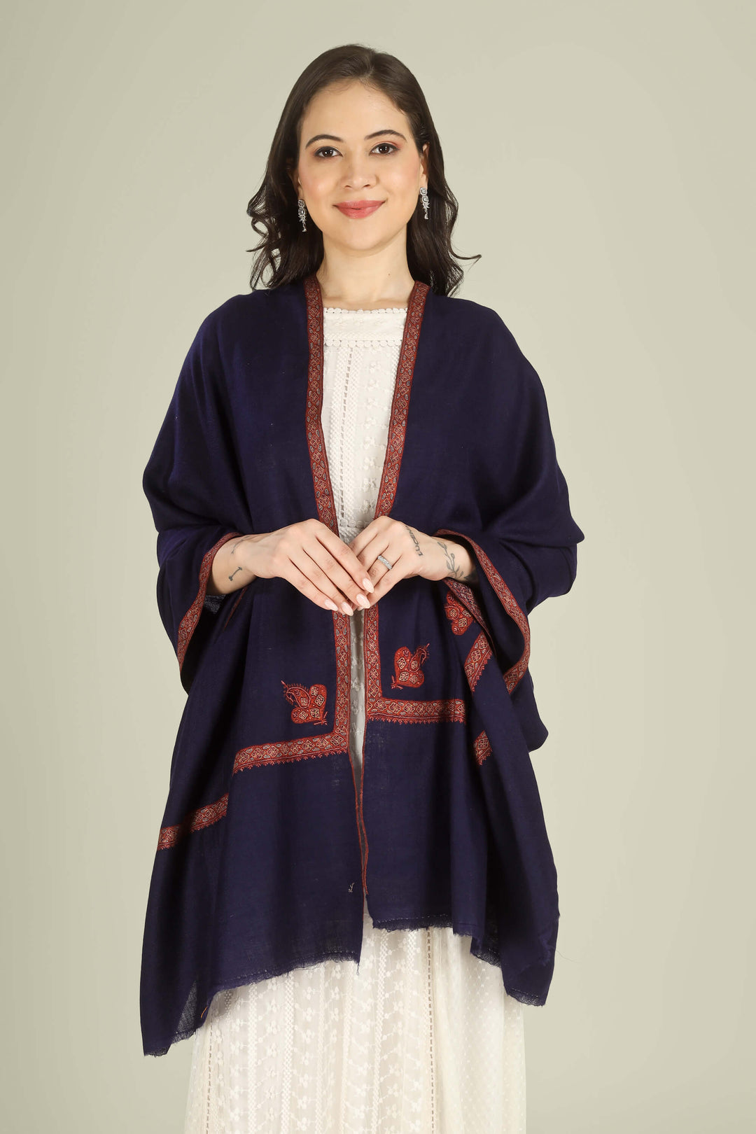 This Navy GI Kashmiri Pure Pashmina Nusrat Hashidaar Shawl showcases a deep navy base framed with a rich rust–orange Nusrat hashidaar border and a single paisley corner motif, giving a bold colour contrast with refined, minimal detailing.