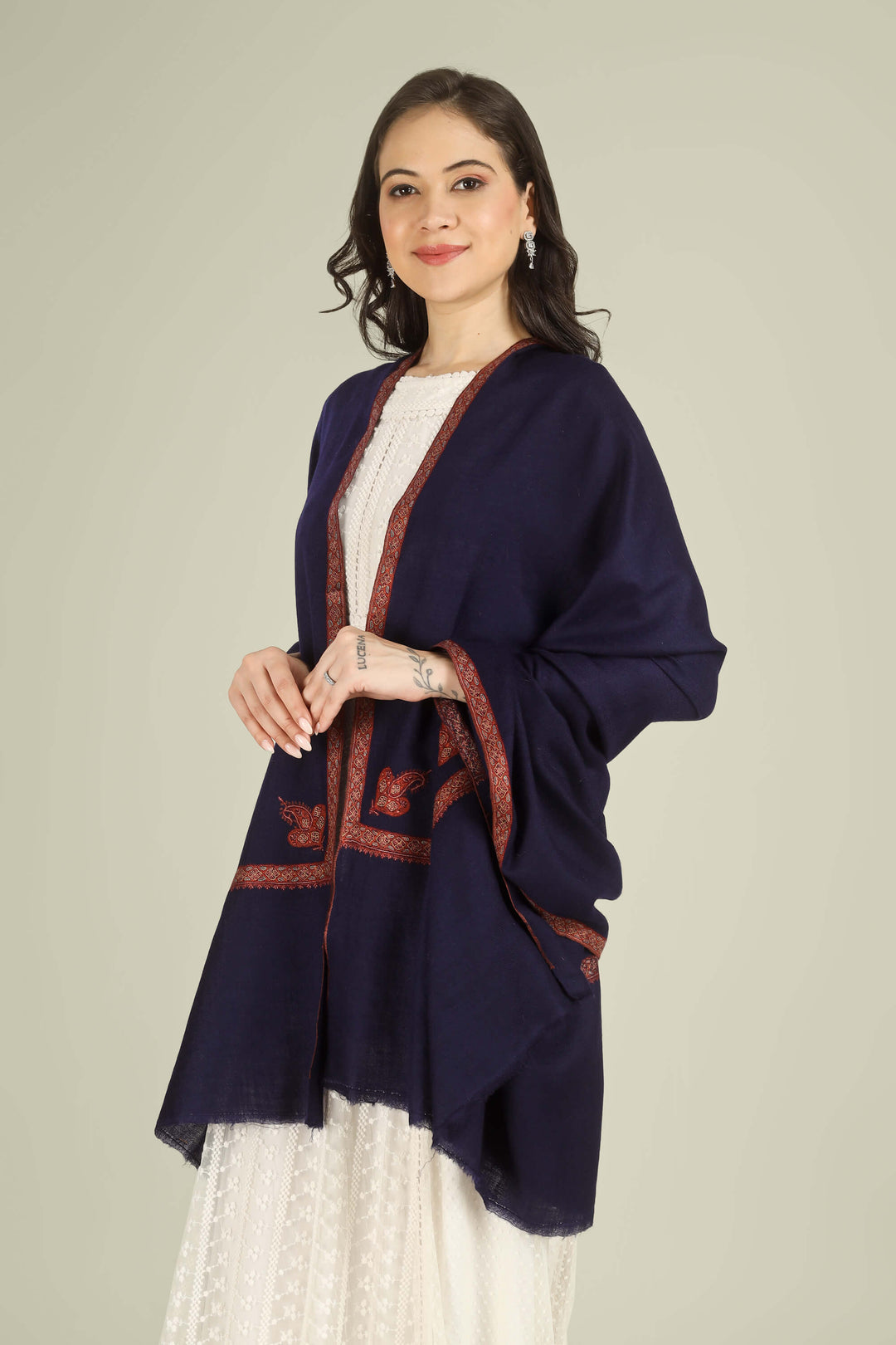 This Navy GI Kashmiri Pure Pashmina Nusrat Hashidaar Shawl showcases a deep navy base framed with a rich rust–orange Nusrat hashidaar border and a single paisley corner motif, giving a bold colour contrast with refined, minimal detailing.