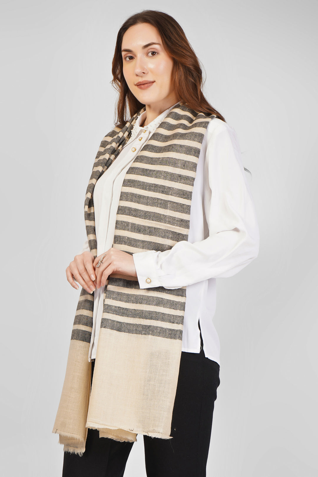 Beige and Grey Striped Pashmina Stoles Online – Contemporary Simplicity
Refine your style with this Beige and Grey Striped Designer Pashmina Stole, handwoven in Kashmir using the softest pure pashmina wool.