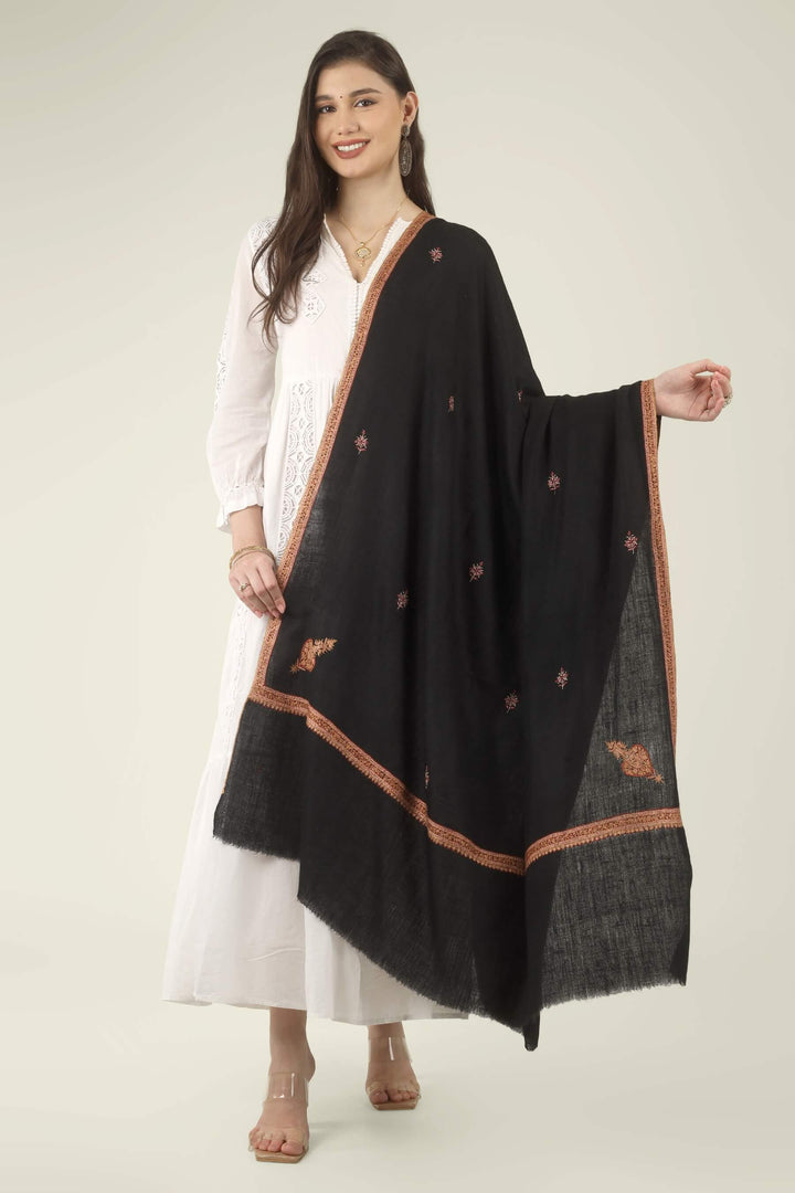 This Black GI Kashmiri Pure Pashmina Hashidaar Embroidered Shawl features a deep, solid black body framed by a richly worked border in copper, rust and soft pink, with small floral buti motifs scattered across the ground.
    
      | pashmina shawls online | authentic Kashmiri pashmina shawl online | pure pashmina shawl online | original GI certified pashmina shawl online | luxury men's pashmina shawl online from Kashmir | where to buy online pure pashmina in India
    
    | GI Tag Certified - Government-verified authentic Kashmiri Pashmina
    | G20 Official Partner - Selected by India for G20 Summit gifting
    | Handicraft Registered - Official recognition of traditional craftsmanship
    | Certificate of Authenticity - Every purchase includes GI certification
