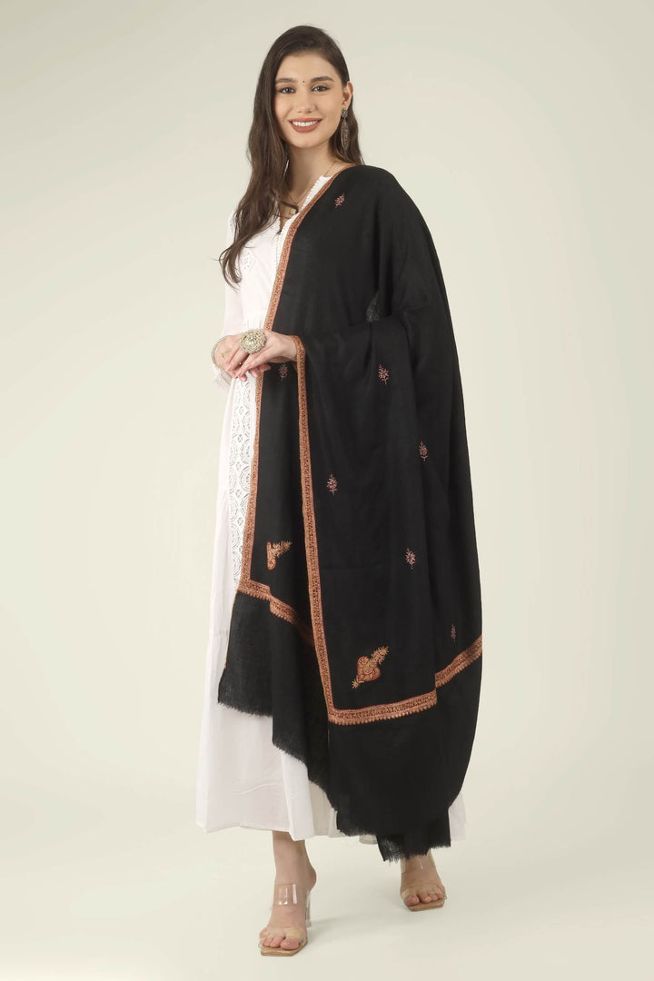 This Black GI Kashmiri Pure Pashmina Hashidaar Embroidered Shawl features a deep, solid black body framed by a richly worked border in copper, rust and soft pink, with small floral buti motifs scattered across the ground.
    
      | pashmina shawls online | authentic Kashmiri pashmina shawl online | pure pashmina shawl online | original GI certified pashmina shawl online | luxury men's pashmina shawl online from Kashmir | where to buy online pure pashmina in India
    
    | GI Tag Certified - Government-verified authentic Kashmiri Pashmina
    | G20 Official Partner - Selected by India for G20 Summit gifting
    | Handicraft Registered - Official recognition of traditional craftsmanship
    | Certificate of Authenticity - Every purchase includes GI certification