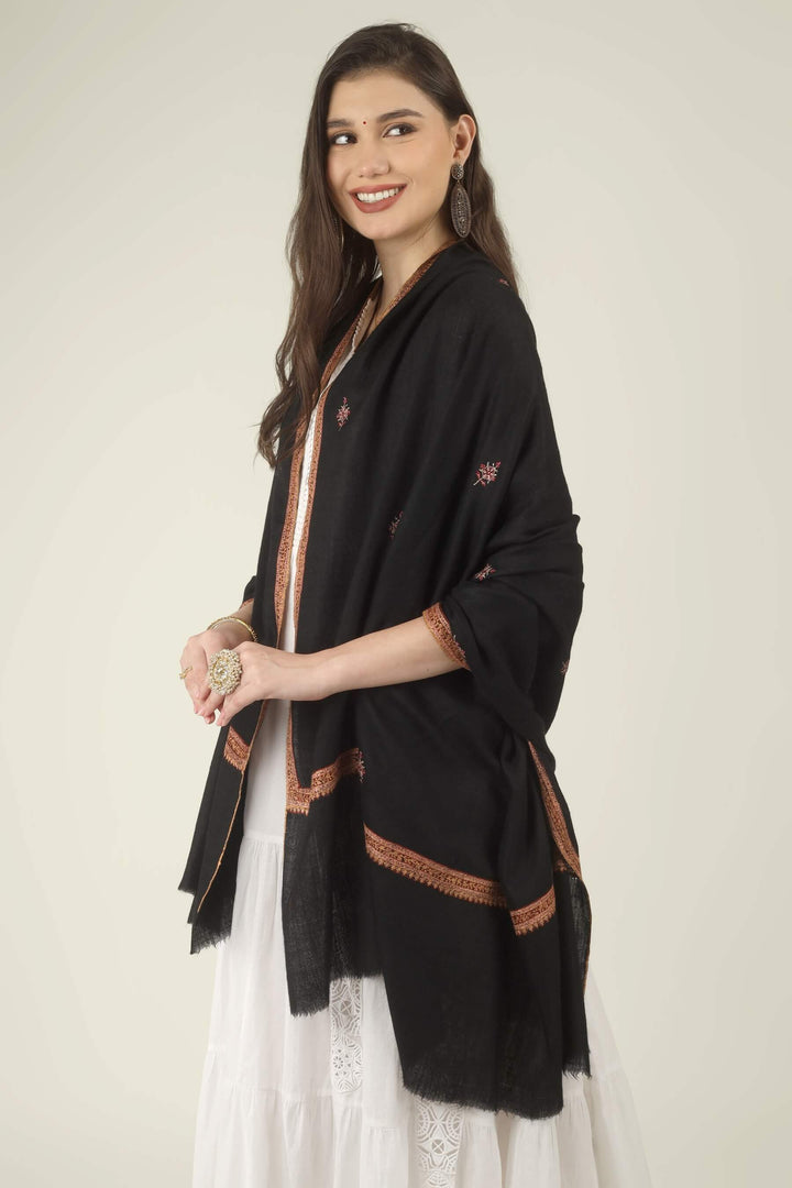 This Black GI Kashmiri Pure Pashmina Hashidaar Embroidered Shawl features a deep, solid black body framed by a richly worked border in copper, rust and soft pink, with small floral buti motifs scattered across the ground.
    
      | pashmina shawls online | authentic Kashmiri pashmina shawl online | pure pashmina shawl online | original GI certified pashmina shawl online | luxury men's pashmina shawl online from Kashmir | where to buy online pure pashmina in India
    
    | GI Tag Certified - Government-verified authentic Kashmiri Pashmina
    | G20 Official Partner - Selected by India for G20 Summit gifting
    | Handicraft Registered - Official recognition of traditional craftsmanship
    | Certificate of Authenticity - Every purchase includes GI certification
