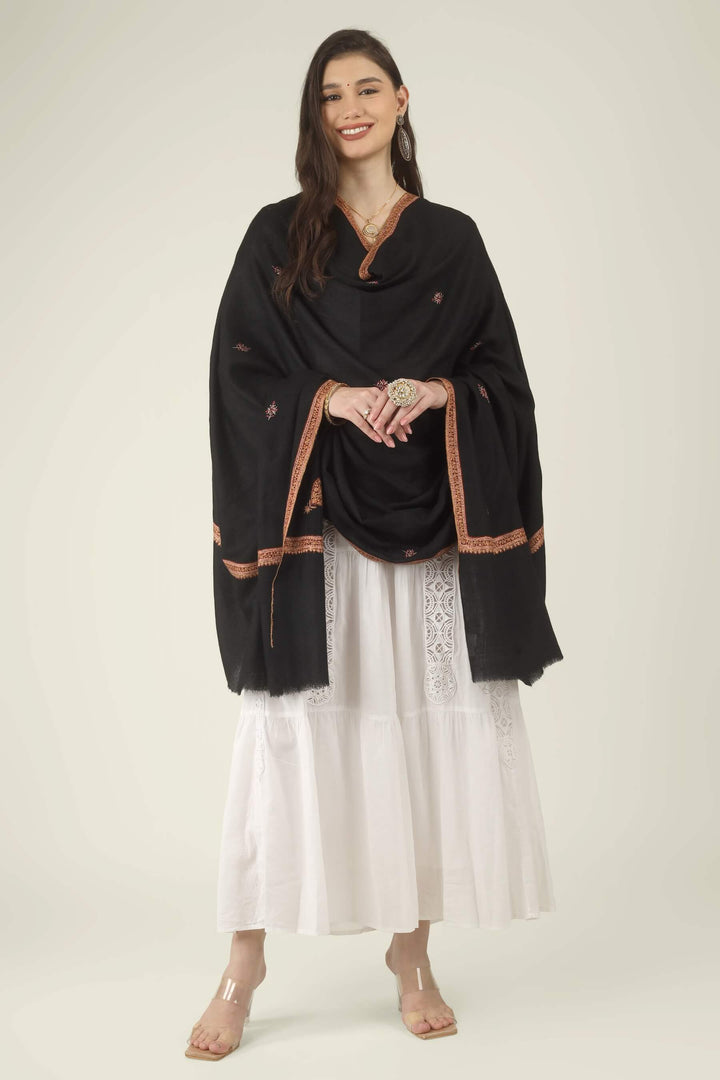 This Black GI Kashmiri Pure Pashmina Hashidaar Embroidered Shawl features a deep, solid black body framed by a richly worked border in copper, rust and soft pink, with small floral buti motifs scattered across the ground.
    
      | pashmina shawls online | authentic Kashmiri pashmina shawl online | pure pashmina shawl online | original GI certified pashmina shawl online | luxury men's pashmina shawl online from Kashmir | where to buy online pure pashmina in India
    
    | GI Tag Certified - Government-verified authentic Kashmiri Pashmina
    | G20 Official Partner - Selected by India for G20 Summit gifting
    | Handicraft Registered - Official recognition of traditional craftsmanship
    | Certificate of Authenticity - Every purchase includes GI certification