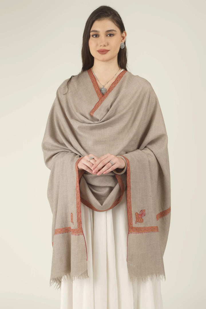 This Natural Khudrang GI Kashmiri Pure Pashmina Border Embroidered Shawl features a beautifully textured, undyed oatmeal-beige body. It is elegantly framed by continuous, richly worked red and orange borders
    
      | pashmina shawls online | authentic Kashmiri pashmina shawl online | pure pashmina shawl online | original GI certified pashmina shawl online | luxury men's pashmina shawl online from Kashmir | where to buy online pure pashmina in India
    
    | GI Tag Certified - Government-verified authentic Kashmiri Pashmina
    | G20 Official Partner - Selected by India for G20 Summit gifting
    | Handicraft Registered - Official recognition of traditional craftsmanship
    | Certificate of Authenticity - Every purchase includes GI certification