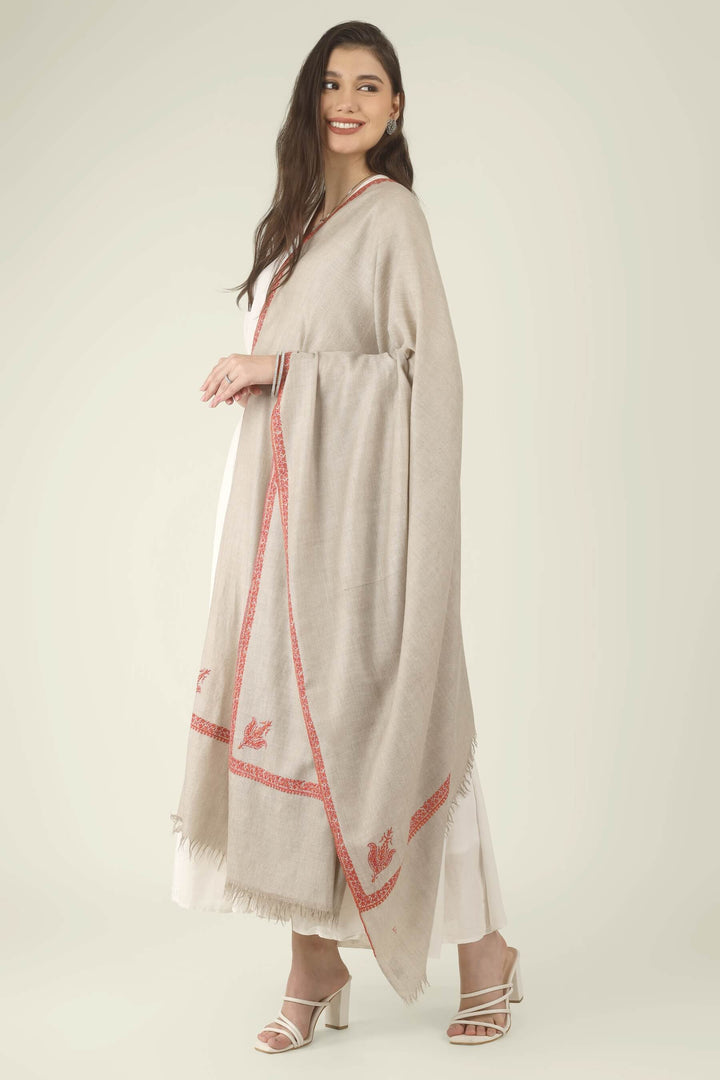 This Natural Khudrang GI Kashmiri Pure Pashmina Hashidaar Embroidered Shawl features a soft, undyed oatmeal-beige body framed by richly worked borders and paisley motifs in vivid red and warm orange
    
      | pashmina shawls online | authentic Kashmiri pashmina shawl online | pure pashmina shawl online | original GI certified pashmina shawl online | luxury men's pashmina shawl online from Kashmir | where to buy online pure pashmina in India
    
    | GI Tag Certified - Government-verified authentic Kashmiri Pashmina
    | G20 Official Partner - Selected by India for G20 Summit gifting
    | Handicraft Registered - Official recognition of traditional craftsmanship
    | Certificate of Authenticity - Every purchase includes GI certification