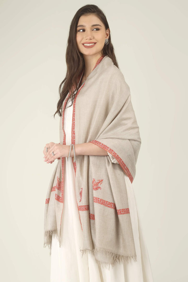 This Natural Khudrang GI Kashmiri Pure Pashmina Hashidaar Embroidered Shawl features a soft, undyed oatmeal-beige body framed by richly worked borders and paisley motifs in vivid red and warm orange
    
      | pashmina shawls online | authentic Kashmiri pashmina shawl online | pure pashmina shawl online | original GI certified pashmina shawl online | luxury men's pashmina shawl online from Kashmir | where to buy online pure pashmina in India
    
    | GI Tag Certified - Government-verified authentic Kashmiri Pashmina
    | G20 Official Partner - Selected by India for G20 Summit gifting
    | Handicraft Registered - Official recognition of traditional craftsmanship
    | Certificate of Authenticity - Every purchase includes GI certification