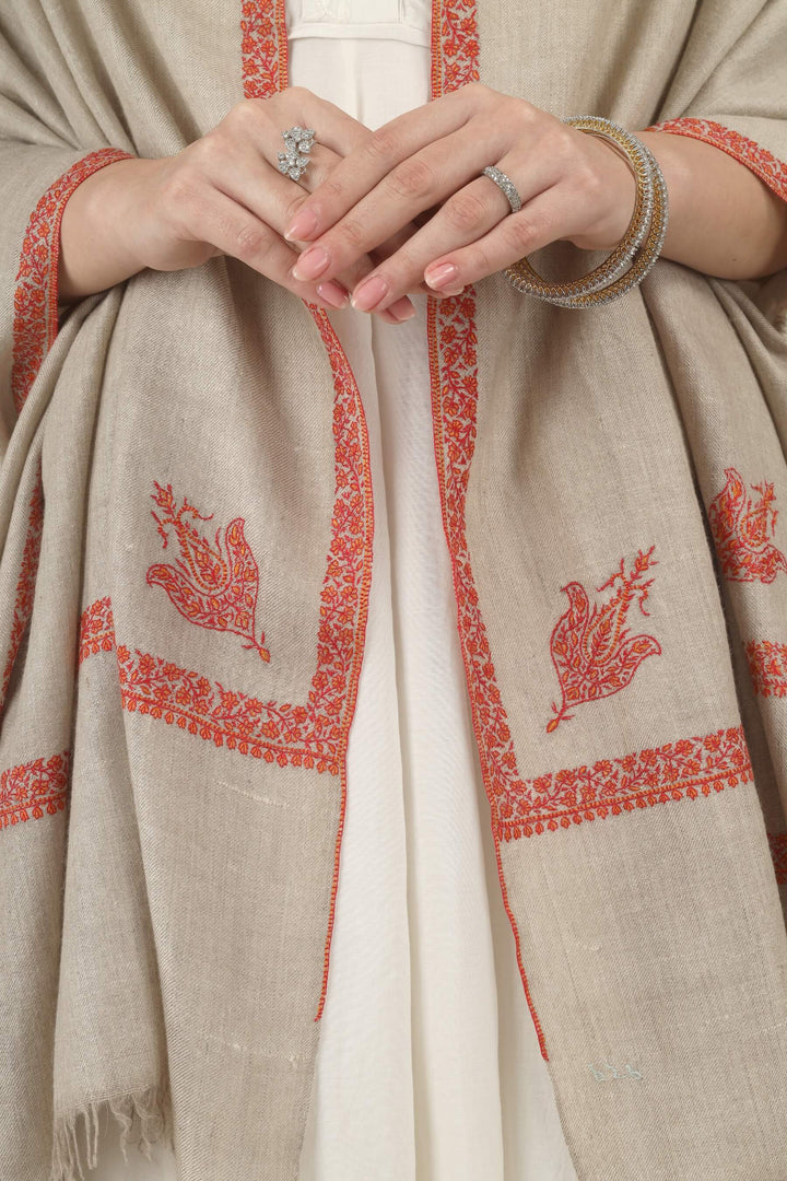 This Natural Khudrang GI Kashmiri Pure Pashmina Hashidaar Embroidered Shawl features a soft, undyed oatmeal-beige body framed by richly worked borders and paisley motifs in vivid red and warm orange
    
      | pashmina shawls online | authentic Kashmiri pashmina shawl online | pure pashmina shawl online | original GI certified pashmina shawl online | luxury men's pashmina shawl online from Kashmir | where to buy online pure pashmina in India
    
    | GI Tag Certified - Government-verified authentic Kashmiri Pashmina
    | G20 Official Partner - Selected by India for G20 Summit gifting
    | Handicraft Registered - Official recognition of traditional craftsmanship
    | Certificate of Authenticity - Every purchase includes GI certification