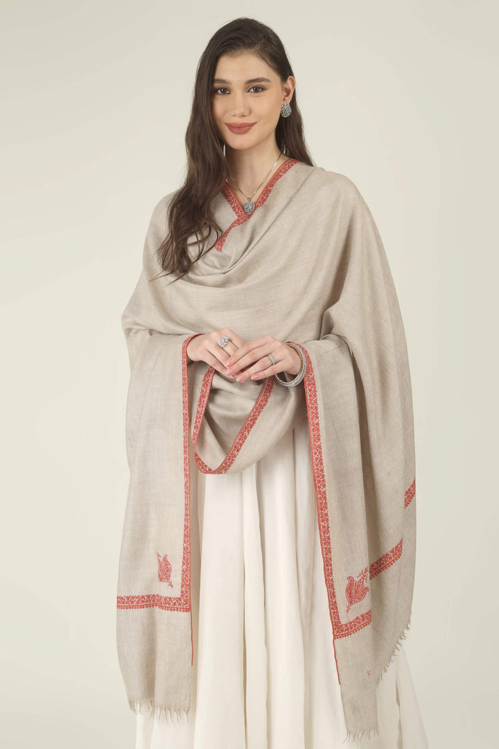 This Natural Khudrang GI Kashmiri Pure Pashmina Hashidaar Embroidered Shawl features a soft, undyed oatmeal-beige body framed by richly worked borders and paisley motifs in vivid red and warm orange
    
      | pashmina shawls online | authentic Kashmiri pashmina shawl online | pure pashmina shawl online | original GI certified pashmina shawl online | luxury men's pashmina shawl online from Kashmir | where to buy online pure pashmina in India
    
    | GI Tag Certified - Government-verified authentic Kashmiri Pashmina
    | G20 Official Partner - Selected by India for G20 Summit gifting
    | Handicraft Registered - Official recognition of traditional craftsmanship
    | Certificate of Authenticity - Every purchase includes GI certification