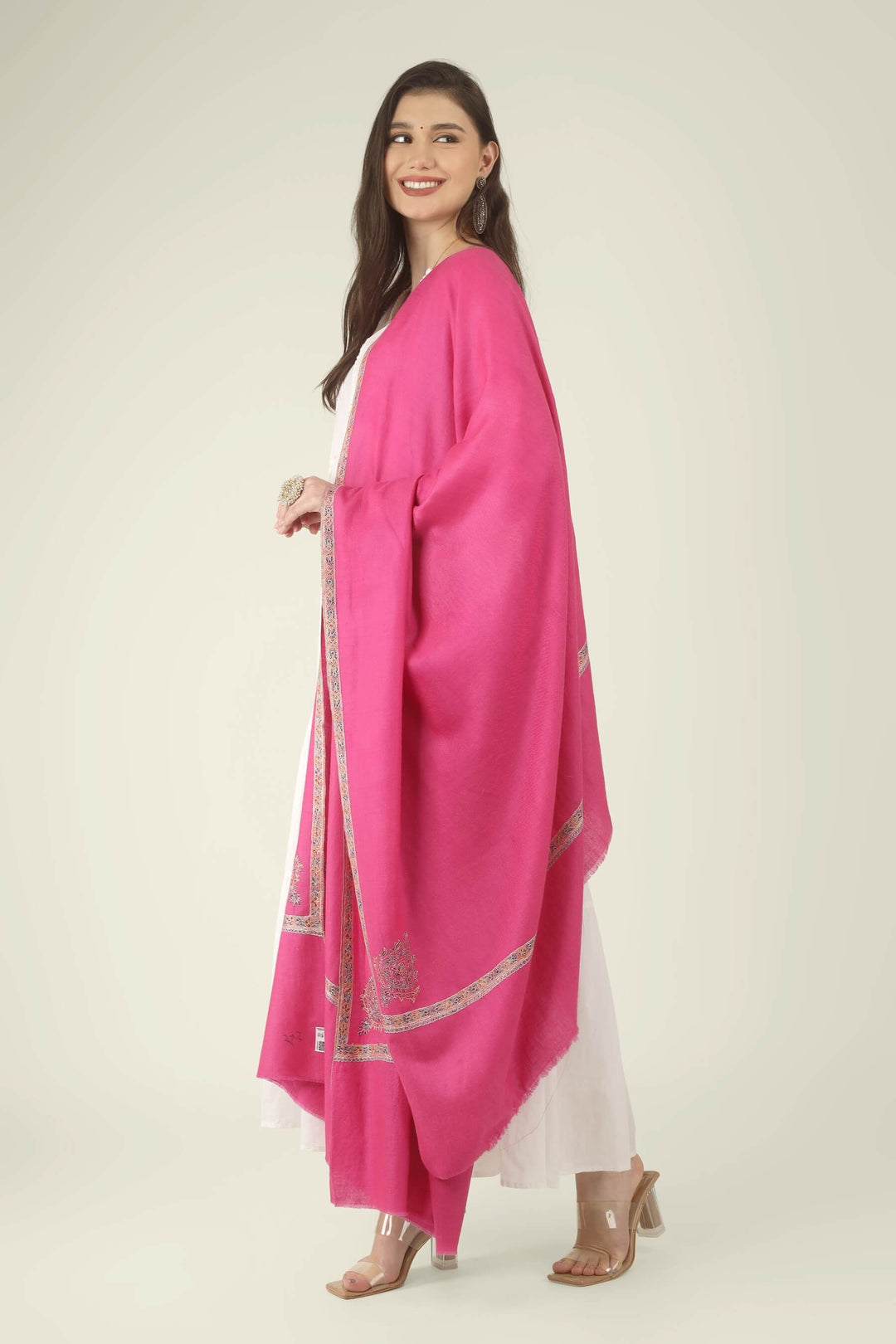 The saturated pink tone is beautifully balanced by the soft multicolour border, creating a look that is festive, graceful and timeless.