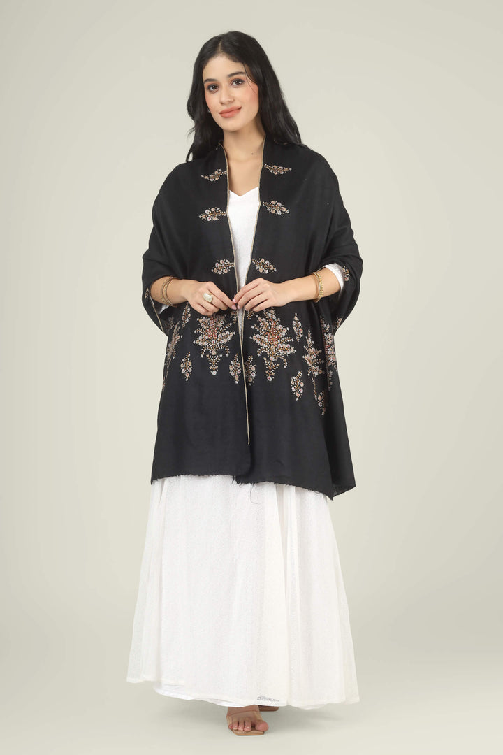 Model wearing a black GI Kashmiri Pure Pashmina stole with delicate multicolour floral Sozni embroidery over a white dress.
    
      | pashmina shawls online | authentic Kashmiri pashmina shawl online | pure pashmina shawl online | original GI certified pashmina shawl online | luxury men's pashmina shawl online from Kashmir | where to buy online pure pashmina in India
    
    | GI Tag Certified - Government-verified authentic Kashmiri Pashmina
    | G20 Official Partner - Selected by India for G20 Summit gifting
    | Handicraft Registered - Official recognition of traditional craftsmanship
    | Certificate of Authenticity - Every purchase includes GI certification