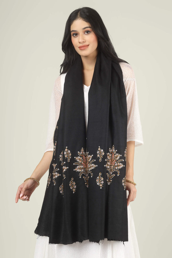Model wearing a black GI Kashmiri Pure Pashmina stole with delicate multicolour floral Sozni embroidery over a white dress.
    
      | pashmina shawls online | authentic Kashmiri pashmina shawl online | pure pashmina shawl online | original GI certified pashmina shawl online | luxury men's pashmina shawl online from Kashmir | where to buy online pure pashmina in India
    
    | GI Tag Certified - Government-verified authentic Kashmiri Pashmina
    | G20 Official Partner - Selected by India for G20 Summit gifting
    | Handicraft Registered - Official recognition of traditional craftsmanship
    | Certificate of Authenticity - Every purchase includes GI certification