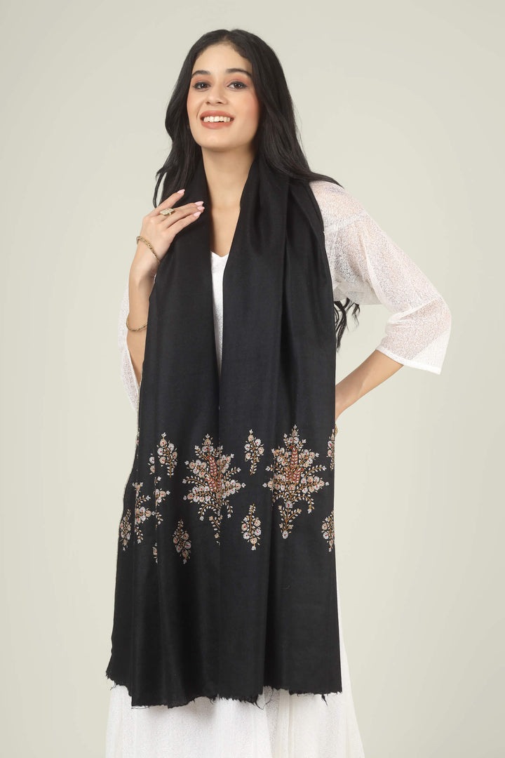 Model wearing a black GI Kashmiri Pure Pashmina stole with delicate multicolour floral Sozni embroidery over a white dress.
    
      | pashmina shawls online | authentic Kashmiri pashmina shawl online | pure pashmina shawl online | original GI certified pashmina shawl online | luxury men's pashmina shawl online from Kashmir | where to buy online pure pashmina in India
    
    | GI Tag Certified - Government-verified authentic Kashmiri Pashmina
    | G20 Official Partner - Selected by India for G20 Summit gifting
    | Handicraft Registered - Official recognition of traditional craftsmanship
    | Certificate of Authenticity - Every purchase includes GI certification