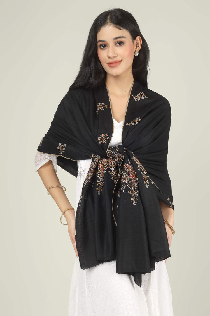 Model wearing a black GI Kashmiri Pure Pashmina stole with delicate multicolour floral Sozni embroidery over a white dress.
    
      | pashmina shawls online | authentic Kashmiri pashmina shawl online | pure pashmina shawl online | original GI certified pashmina shawl online | luxury men's pashmina shawl online from Kashmir | where to buy online pure pashmina in India
    
    | GI Tag Certified - Government-verified authentic Kashmiri Pashmina
    | G20 Official Partner - Selected by India for G20 Summit gifting
    | Handicraft Registered - Official recognition of traditional craftsmanship
    | Certificate of Authenticity - Every purchase includes GI certification