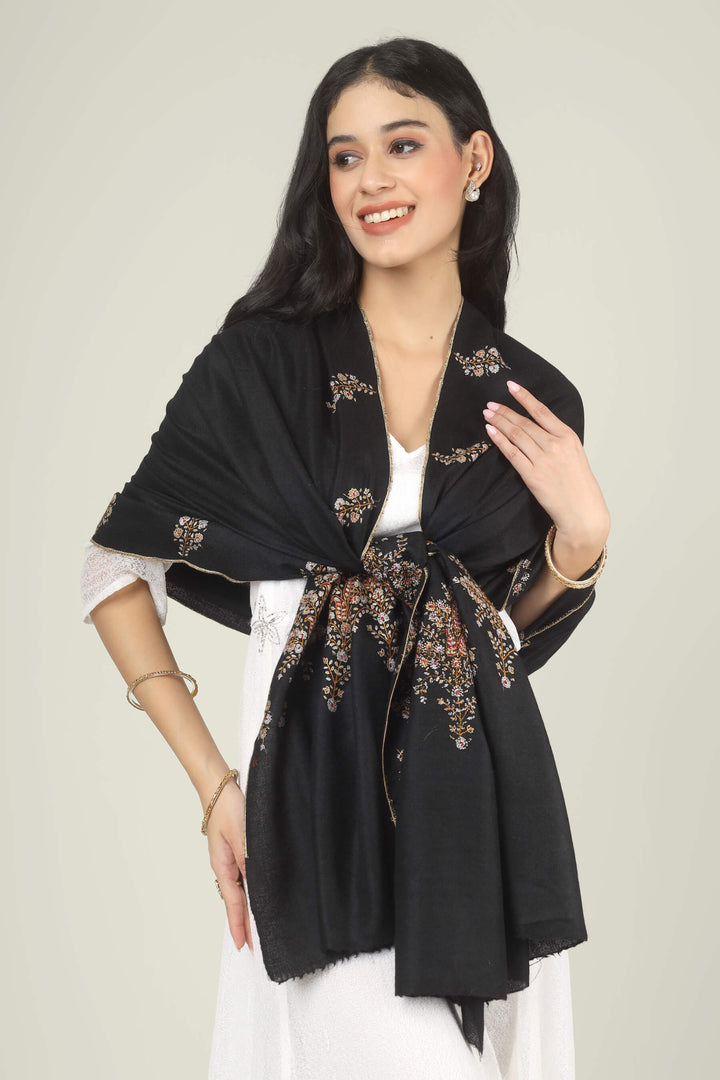 Model wearing a black GI Kashmiri Pure Pashmina stole with delicate multicolour floral Sozni embroidery over a white dress.
    
      | pashmina shawls online | authentic Kashmiri pashmina shawl online | pure pashmina shawl online | original GI certified pashmina shawl online | luxury men's pashmina shawl online from Kashmir | where to buy online pure pashmina in India
    
    | GI Tag Certified - Government-verified authentic Kashmiri Pashmina
    | G20 Official Partner - Selected by India for G20 Summit gifting
    | Handicraft Registered - Official recognition of traditional craftsmanship
    | Certificate of Authenticity - Every purchase includes GI certification