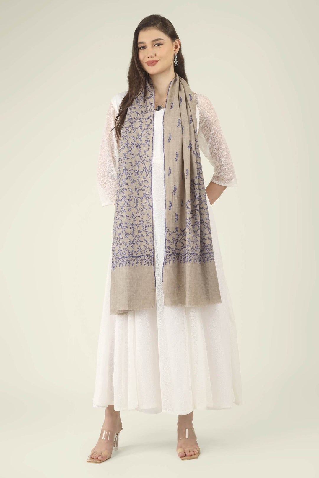 This Beige GI Kashmiri Pure Pashmina Blue Jaal Embroidered Stole features a soft natural beige base covered in fine royal blue floral vines. Delicate leaves, tiny buds and curling tendrils 
