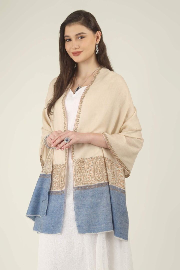 This Cream GI Kashmiri Pure Pashmina Paisley Embroidered Stole features a soft ivory-cream body with a richly worked paisley border and a contrasting panel of denim blue at the ends.
    
      | pashmina shawls online | authentic Kashmiri pashmina shawl online | pure pashmina shawl online | original GI certified pashmina shawl online | luxury men's pashmina shawl online from Kashmir | where to buy online pure pashmina in India
    
    | GI Tag Certified - Government-verified authentic Kashmiri Pashmina
    | G20 Official Partner - Selected by India for G20 Summit gifting
    | Handicraft Registered - Official recognition of traditional craftsmanship
    | Certificate of Authenticity - Every purchase includes GI certification