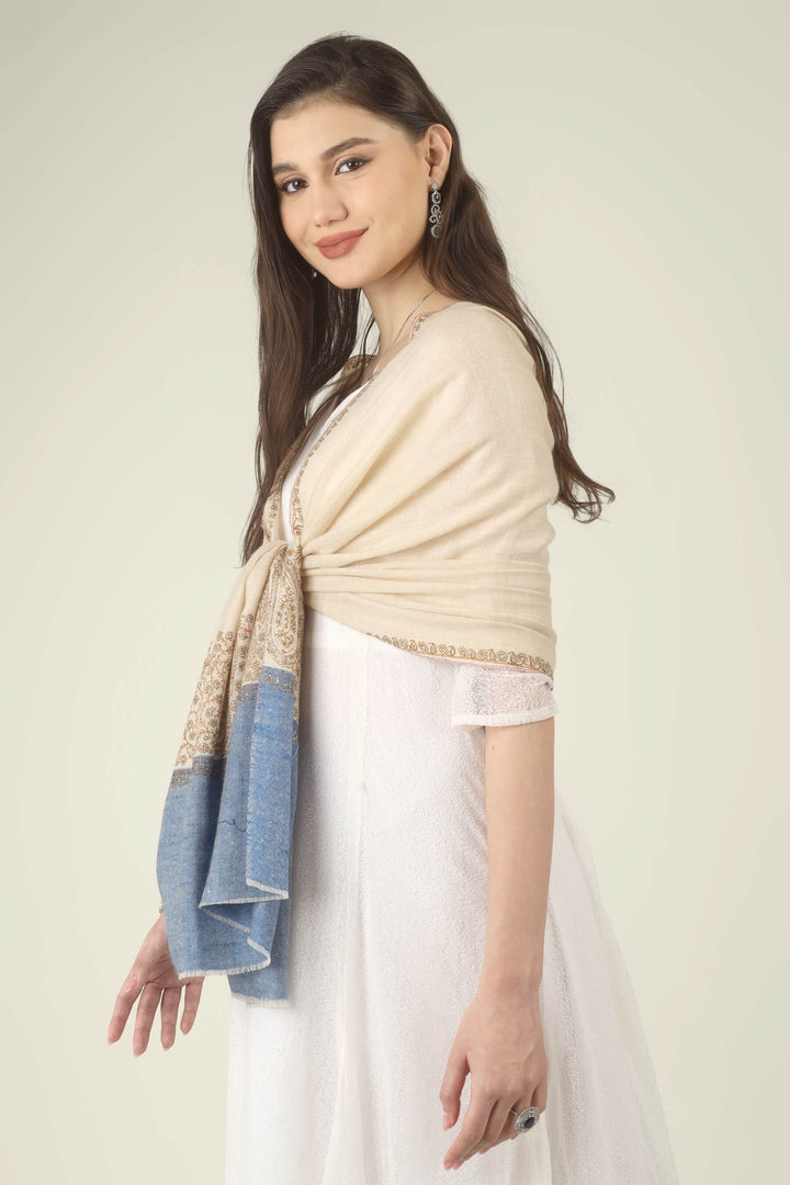 This Cream GI Kashmiri Pure Pashmina Paisley Embroidered Stole features a soft ivory-cream body with a richly worked paisley border and a contrasting panel of denim blue at the ends.
    
      | pashmina shawls online | authentic Kashmiri pashmina shawl online | pure pashmina shawl online | original GI certified pashmina shawl online | luxury men's pashmina shawl online from Kashmir | where to buy online pure pashmina in India
    
    | GI Tag Certified - Government-verified authentic Kashmiri Pashmina
    | G20 Official Partner - Selected by India for G20 Summit gifting
    | Handicraft Registered - Official recognition of traditional craftsmanship
    | Certificate of Authenticity - Every purchase includes GI certification