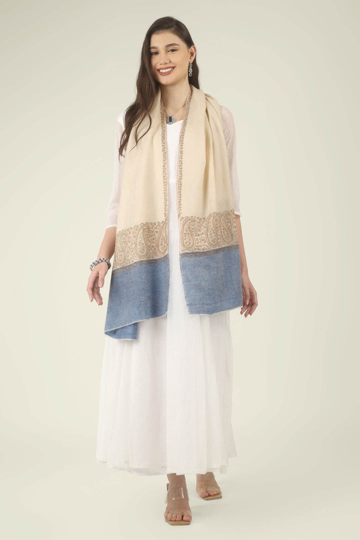 This Cream GI Kashmiri Pure Pashmina Paisley Embroidered Stole features a soft ivory-cream body with a richly worked paisley border and a contrasting panel of denim blue at the ends.
    
      | pashmina shawls online | authentic Kashmiri pashmina shawl online | pure pashmina shawl online | original GI certified pashmina shawl online | luxury men's pashmina shawl online from Kashmir | where to buy online pure pashmina in India
    
    | GI Tag Certified - Government-verified authentic Kashmiri Pashmina
    | G20 Official Partner - Selected by India for G20 Summit gifting
    | Handicraft Registered - Official recognition of traditional craftsmanship
    | Certificate of Authenticity - Every purchase includes GI certification