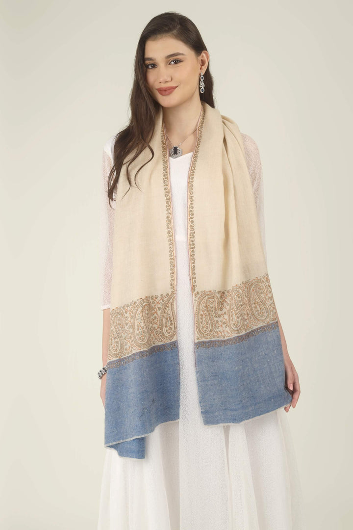 This Cream GI Kashmiri Pure Pashmina Paisley Embroidered Stole features a soft ivory-cream body with a richly worked paisley border and a contrasting panel of denim blue at the ends.
    
      | pashmina shawls online | authentic Kashmiri pashmina shawl online | pure pashmina shawl online | original GI certified pashmina shawl online | luxury men's pashmina shawl online from Kashmir | where to buy online pure pashmina in India
    
    | GI Tag Certified - Government-verified authentic Kashmiri Pashmina
    | G20 Official Partner - Selected by India for G20 Summit gifting
    | Handicraft Registered - Official recognition of traditional craftsmanship
    | Certificate of Authenticity - Every purchase includes GI certification