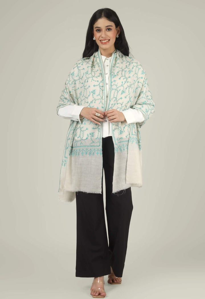 Close-up of a white GI Kashmiri Pure Pashmina stole with turquoise-green floral jaal Sozni embroidery knotted at the front over a white shirt.
    
      | pashmina shawls online | authentic Kashmiri pashmina shawl online | pure pashmina shawl online | original GI certified pashmina shawl online | luxury men's pashmina shawl online from Kashmir | where to buy online pure pashmina in India
    
    | GI Tag Certified - Government-verified authentic Kashmiri Pashmina
    | G20 Official Partner - Selected by India for G20 Summit gifting
    | Handicraft Registered - Official recognition of traditional craftsmanship
    | Certificate of Authenticity - Every purchase includes GI certification